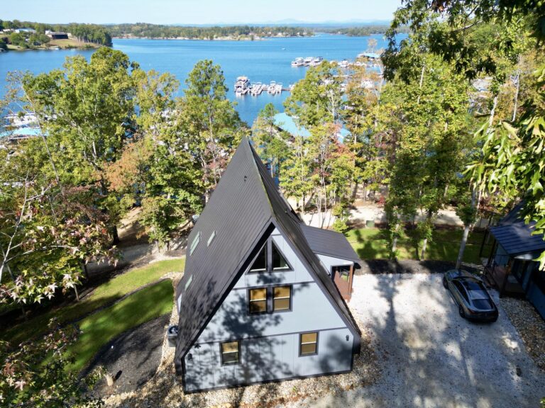 Aerial of the cottage with the marina behind