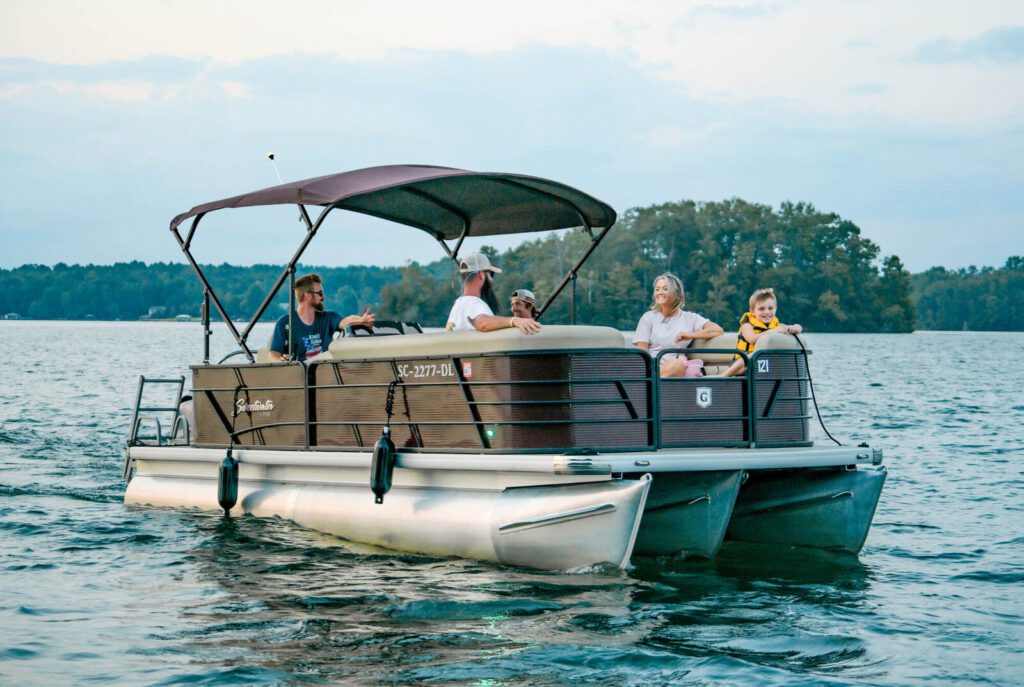 Family on a tritoon on Lake Keowee